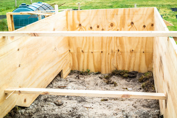 Steel rod reinforcement before pouring concrete into wooden frame