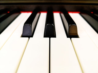 Electric piano keyboard background with selected focus Warm color picture,close up