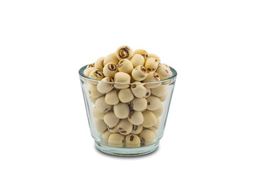 Dried Lotus seeds in a glass bowl on white background with clipping path. Nowadays lotus seed become popular healthy food and has highly beneficial for health.