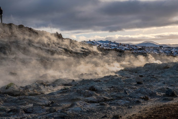 Clouds of water vapor smelling sulfur sprouts in the Hverir volcanic area, Iceland