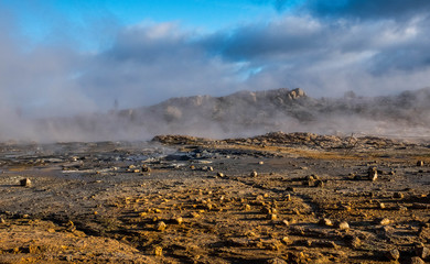 Clouds of water vapor smelling sulfur sprouts in the Hverir volcanic area, Iceland