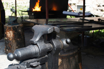 Vise and anvil in a forge shop