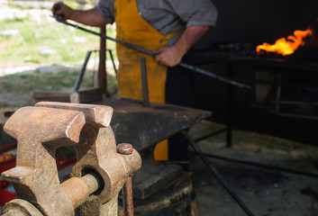Vise and anvil in a forge shop