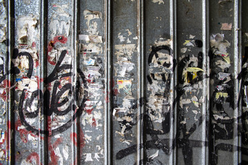 background wall with old ads and graffiti 