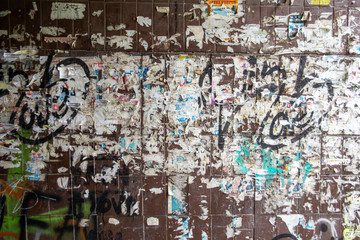 wall with old ads and graffiti background