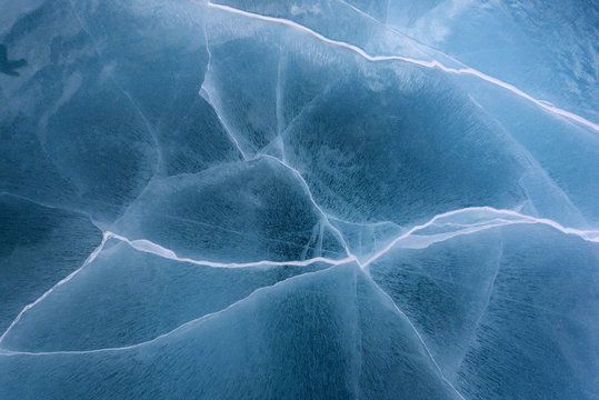 Beautiful ice of Lake Baikal with abstract cracks