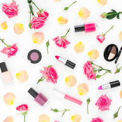 Floral composition with roses flowers and feminine make up cosmetics on white. Flat lay, top view.