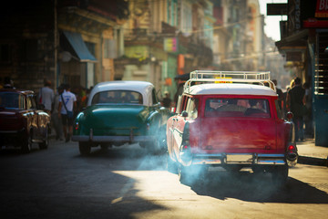 HAVANA - FEBRUARY 25: Classic car and antique buildings on February 25, 2015 in Havana. These vintage cars are an iconic sight of the island