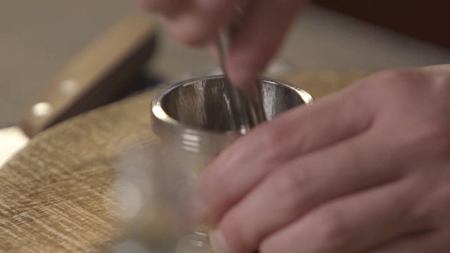 crushing into the jar by using a muddler - panning