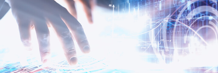 Business concept. Information technology and data processing. Hands over the screen with graphic data. A modern software product in business.