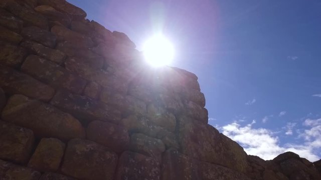 Stone walls and sunlight in sacred plaza, Machu Picchu, Cusco, Peru