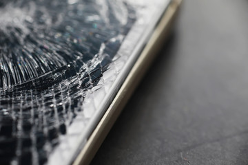 Crack on the glass. Broken screen. Broken phone. Cracked glass background. White cracks in the...
