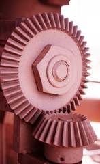 Close up detail of industrial cogs covered in mining ore dust