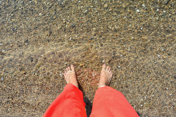 feet in clear sea water