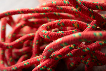 A closeup view of a red multi-purpose polyester rope.