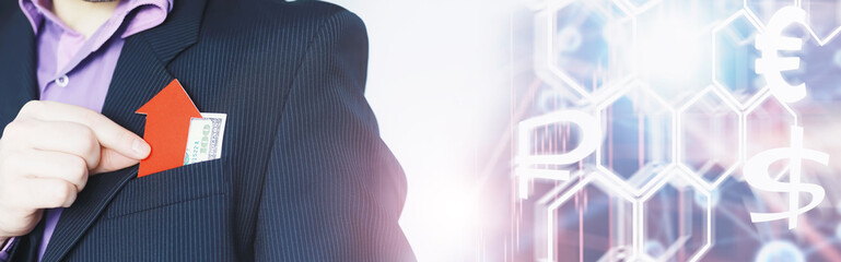 Financial crisis. Concept. Money bills in hand. Arrow symbol of the fall of the national currency. The change in the exchange rate between the Russian ruble and the US dollar.