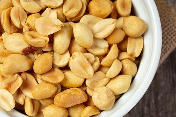 A top down view of a bowl of peanuts.