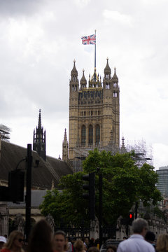 Photo of big ben clock tower and palace of westminster in London. Tourist attraction photo, cloudy and rainy weather