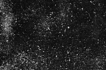 Distressed background. Stained surface layer. White dust scratches on black copy space.
