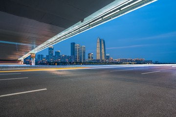 cityscape and skyline of suzhou from empty asphalt road