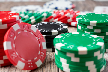 A closeup view of several stacks of standard poker chips.