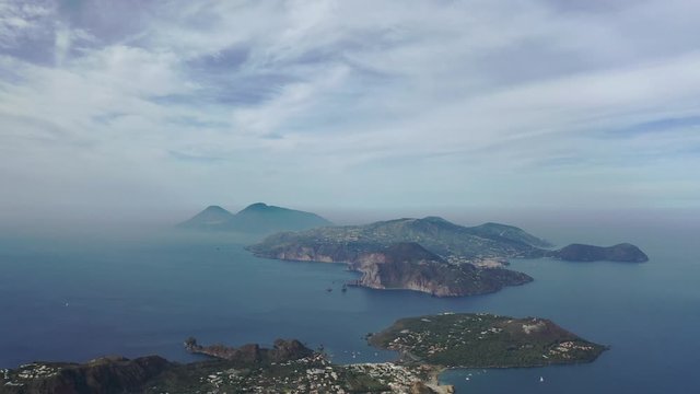 Aerial view 4K video from flying drone of Panoramic view from mountain roadsthe volcano of Vulcano Island in a summer day. The islands of Lipari and Salina Aeolian Islands, Sicily, Italy. (series)