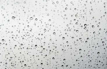 Raindrops on light window glass