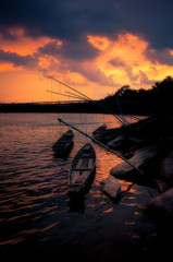 Fototapeta premium Fishing boat mooring at the Moon River in the western part of Ubon Ratchathani Province, Thailand