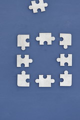 Obraz premium Puzzle on a dark background. Abstract, black