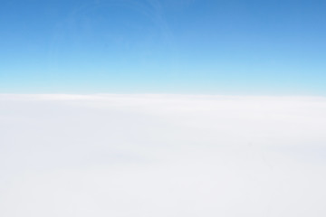 Background of blue sky and white cloud. A view from an airplane