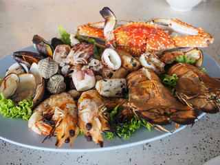 Platter of mix grilled seafood; shrimp, crab, shell, squid, rock lobster