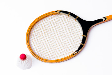 Close-up.Badminton concept.Racket and shuttlecock.Badminton racket and white shuttlecock with red cap on white background.