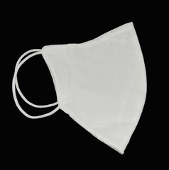 Side view of cloth mask isolated on a Black background, White medical mask isolated. Face mask protection against pollution and Covid-19 virus.