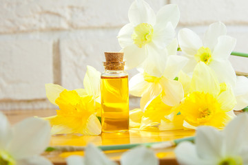 Essence of flowers  on white in beautiful glass jar