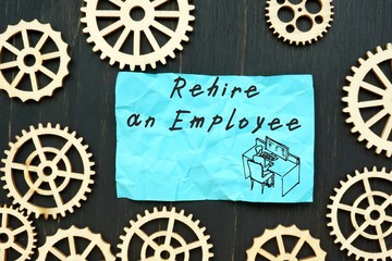 Business concept about Rehire an Employee with inscription on the sheet.