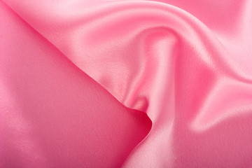 Obraz na płótnie Canvas red silk fabric with waves.