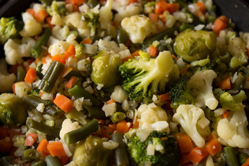 Steamed and chopped vegetables: cauliflower, broccoli, Brussels sprouts, parsnips and carrots. Healthy vegan diet dish.