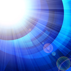 blue circles with bright rays of light © Sergii
