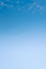 vertical image of a blue sky with a gradient