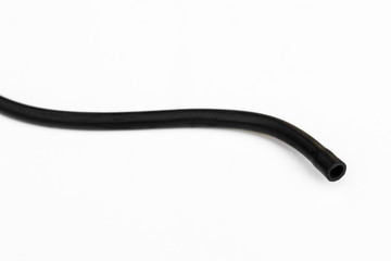 Black rubber fuel hose isolated on white background.