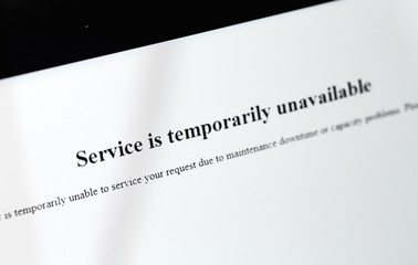 error with text Service temporarily unavailable on the screen with browser, closeup