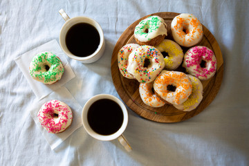 Sweet Donuts And Two Cups Of Coffee