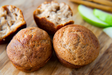 Apple Cinnamon Muffins with apples and cinnamon sticks
