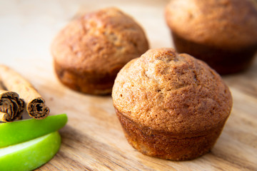 Apple Cinnamon Muffins with apples and cinnamon sticks