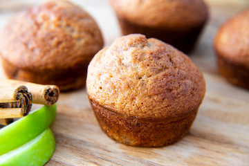 Apple Cinnamon Muffins with apples and cinnamon sticks