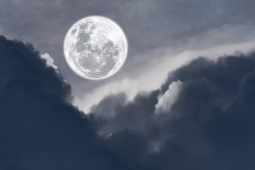 Fototapeta na wymiar Full moon with clouds on the sky.