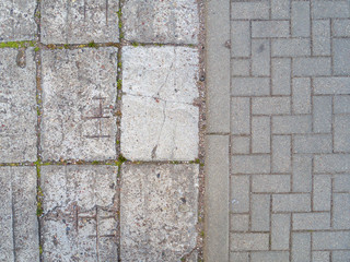 Old and new sidewalk. Different road surface.