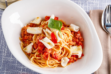 Pasta with squid and tomatoes