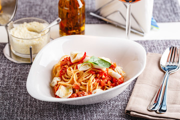 Pasta with squid and tomatoes