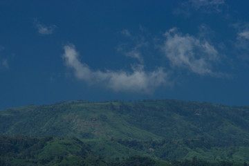 Naklejka premium clouds over the mountains